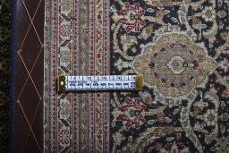 Backside of handmade New Tabriz rug showing knot structure and weave density