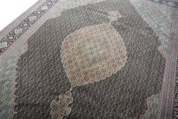 Backside of handmade New Tabriz rug showing knot structure and weave density