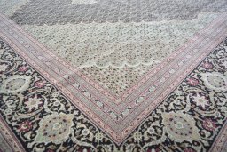 Close-up detail of New Tabriz rug from Iran / Persia showing Cork weave