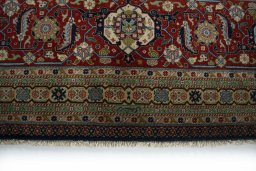 Corner detail of 1930s Tabriz rug showing border pattern and Wool pile