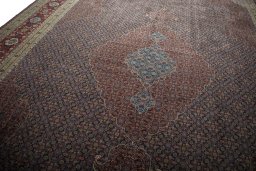 Backside of handmade 1930s Tabriz rug showing knot structure and weave density