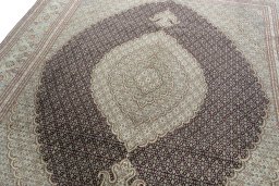 Backside of handmade New Tabriz rug showing knot structure and weave density