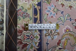 Backside of handmade New Tabriz rug showing knot structure and weave density