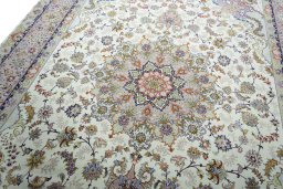 Backside of handmade New Tabriz rug showing knot structure and weave density