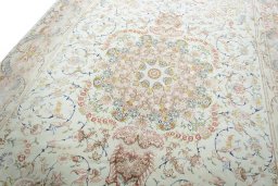 Backside of handmade New Tabriz rug showing knot structure and weave density