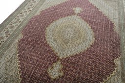 Backside of handmade New Tabriz rug showing knot structure and weave density