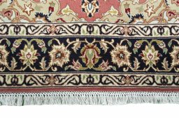 Corner detail of New Tabriz rug showing border pattern and Cork pile