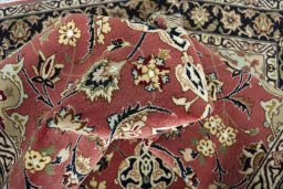 Backside of handmade New Tabriz rug showing knot structure and weave density
