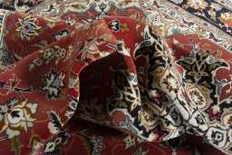 Backside of handmade New Tabriz rug showing knot structure and weave density