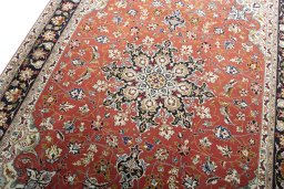 Backside of handmade New Tabriz rug showing knot structure and weave density