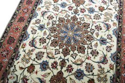 Backside of handmade New Tabriz rug showing knot structure and weave density