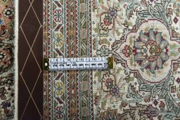 Backside of handmade New Tabriz rug showing knot structure and weave density