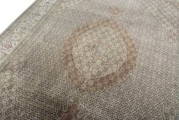 Backside of handmade New Tabriz rug showing knot structure and weave density