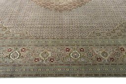 Corner detail of 2000s Tabriz rug showing border pattern and Cork pile