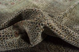 Surface texture of 2000s Tabriz rug with natural Cork and intricate pattern