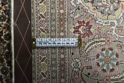 Backside of handmade 2000s Tabriz rug showing knot structure and weave density