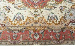 Corner detail of New Tabriz rug showing border pattern and Cork pile