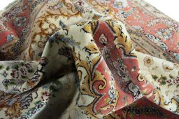 Backside of handmade New Tabriz rug showing knot structure and weave density