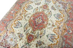Backside of handmade New Tabriz rug showing knot structure and weave density