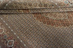 Close-up detail of New Tabriz rug from Iran / Persia showing Cork weave