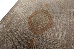Backside of handmade New Tabriz rug showing knot structure and weave density