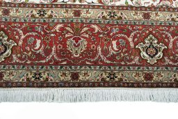 Corner detail of New Tabriz rug showing border pattern and Cork pile