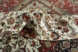 Backside of handmade New Tabriz rug showing knot structure and weave density
