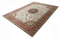 Corner detail of New Tabriz rug showing border pattern and Cork pile