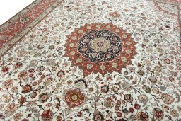 Backside of handmade New Tabriz rug showing knot structure and weave density