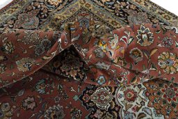 Backside of handmade New Tabriz rug showing knot structure and weave density