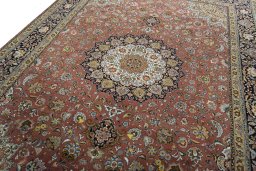 Backside of handmade New Tabriz rug showing knot structure and weave density