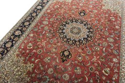 Backside of handmade New Tabriz rug showing knot structure and weave density