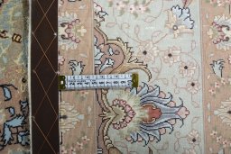 Backside of handmade New Tabriz rug showing knot structure and weave density