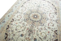Backside of handmade New Tabriz rug showing knot structure and weave density