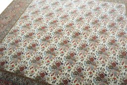 Backside of handmade New Tabriz rug showing knot structure and weave density