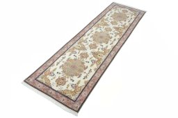Corner detail of New Tabriz rug showing border pattern and Cork pile