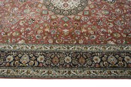Corner detail of New Tabriz rug showing border pattern and Cork pile