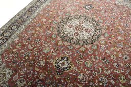 Backside of handmade New Tabriz rug showing knot structure and weave density