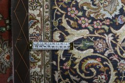 Backside of handmade New Tabriz rug showing knot structure and weave density