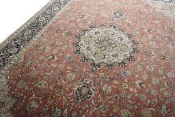 Backside of handmade New Tabriz rug showing knot structure and weave density