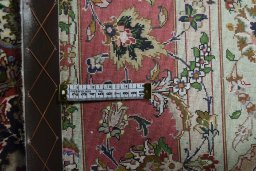 Backside of handmade New Tabriz rug showing knot structure and weave density