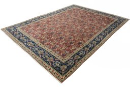 Corner detail of 2000s Tabriz rug showing border pattern and Wool pile