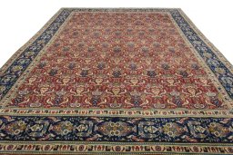 Surface texture of 2000s Tabriz rug with natural Wool and intricate pattern