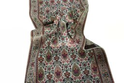 Corner detail of 2000s Tabriz rug showing border pattern and Wool pile