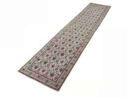 Corner detail of 2000s Tabriz rug showing border pattern and Wool pile