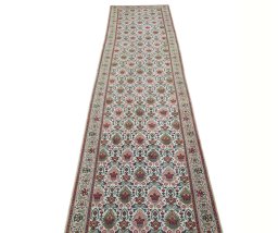 Surface texture of 2000s Tabriz rug with natural Wool and intricate pattern