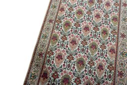 Backside of handmade 2000s Tabriz rug showing knot structure and weave density
