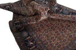 Corner detail of 1930s Tabriz rug showing border pattern and Wool pile