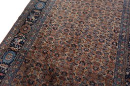 Backside of handmade 1930s Tabriz rug showing knot structure and weave density