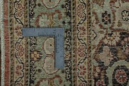 Backside of handmade 1930s Tabriz rug showing knot structure and weave density